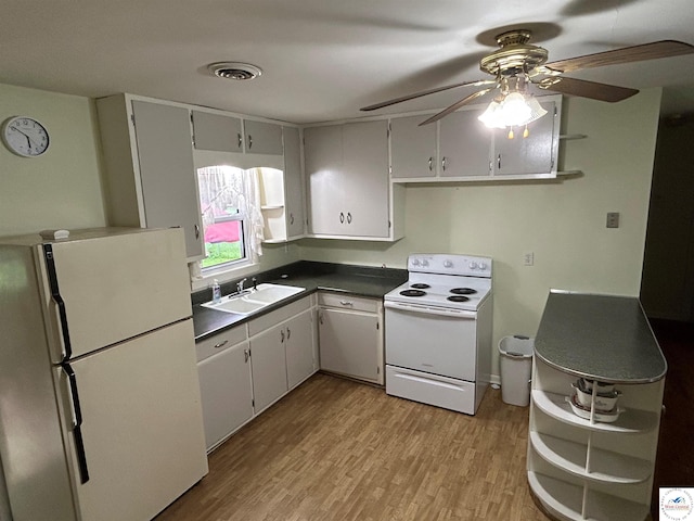 1511 Polk St, Warsaw, MO 65355 - kitchen featuring white appliances, open shelves, a sink, and ceiling fan