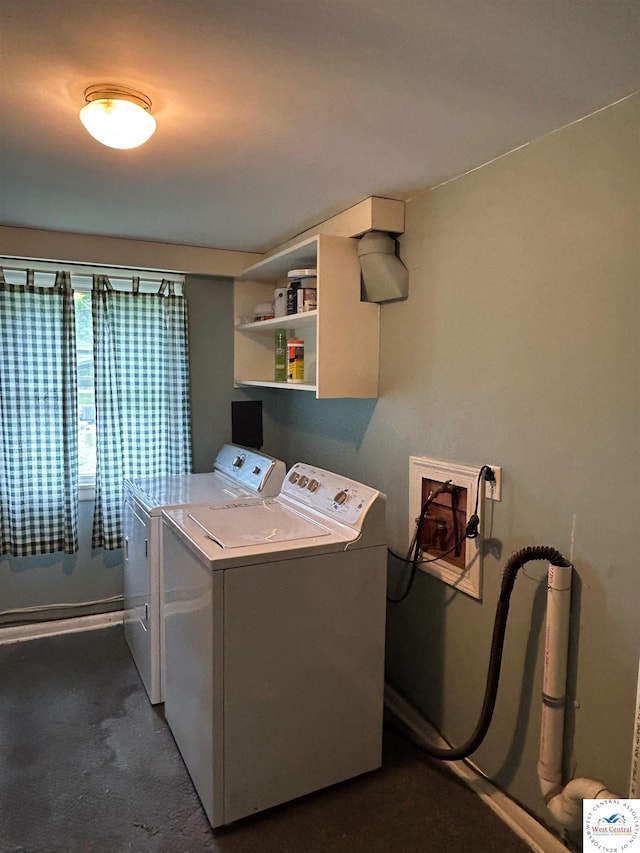 1511 Polk St, Warsaw, MO 65355 - laundry area with washer and clothes dryer, dark colored carpet, and baseboards