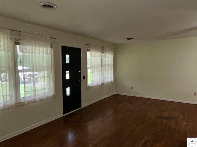 1511 Polk St, Warsaw, MO 65355 - foyer entrance with wood finished floors, plenty of natural light, and baseboards