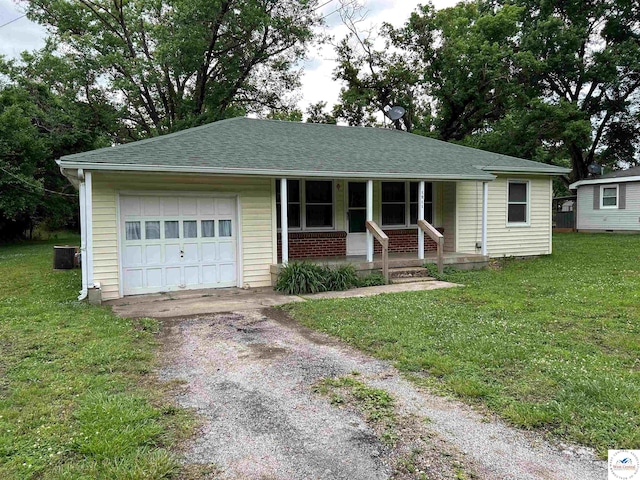 1511 Polk St, Warsaw, MO 65355 - ranch-style home with a porch, asphalt driveway, a garage, and a front lawn
