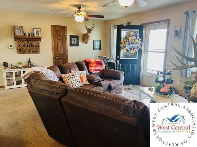 913 S Main St, Milan, MO 63556 - carpeted living room featuring ceiling fan