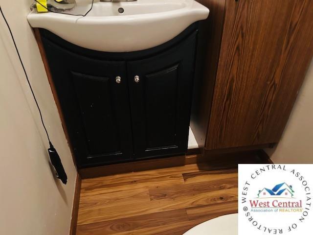 913 S Main St, Milan, MO 63556 - room details with vanity
