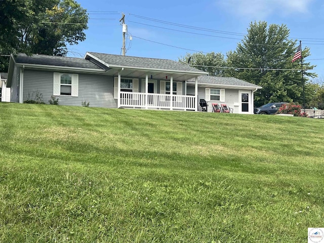 913 S Main St, Milan, MO 63556 - view of front of house with a front yard and covered porch