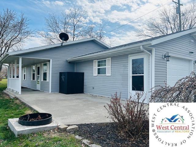 913 S Main St, Milan, MO 63556 - view of property exterior featuring an attached garage