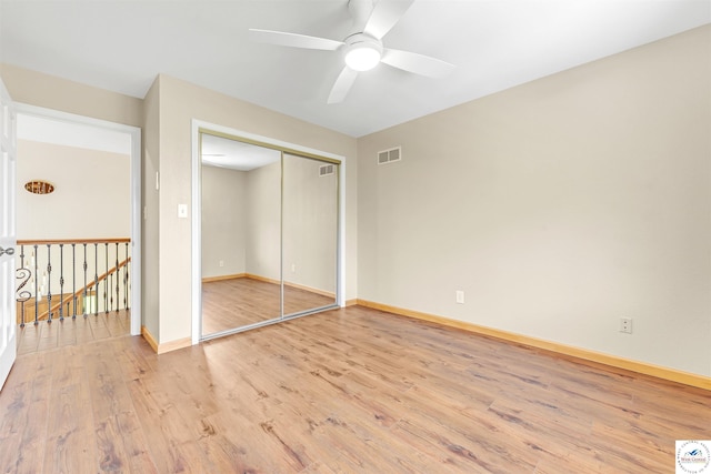 1715 Sycamore Dr, Sedalia, MO 65301 - unfurnished bedroom featuring ceiling fan, visible vents, light wood-style floors, a closet, and baseboards