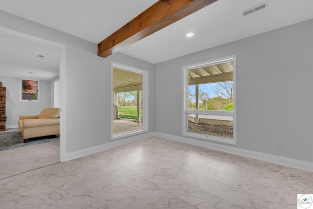 1715 Sycamore Dr, Sedalia, MO 65301 - unfurnished room featuring marble finish floor, visible vents, beam ceiling, and baseboards