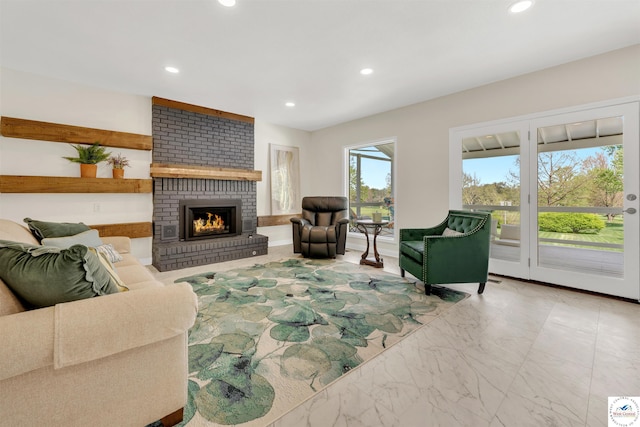 1715 Sycamore Dr, Sedalia, MO 65301 - living area featuring recessed lighting, marble finish floor, and a brick fireplace