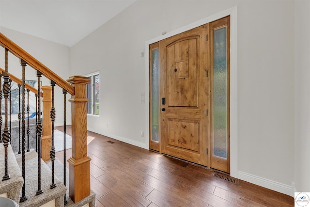1715 Sycamore Dr, Sedalia, MO 65301 - foyer entrance featuring visible vents, hardwood / wood-style flooring, stairs, and baseboards