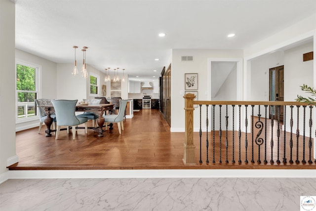 1715 Sycamore Dr, Sedalia, MO 65301 - dining room with recessed lighting, an inviting chandelier, marble finish floor, visible vents, and baseboards