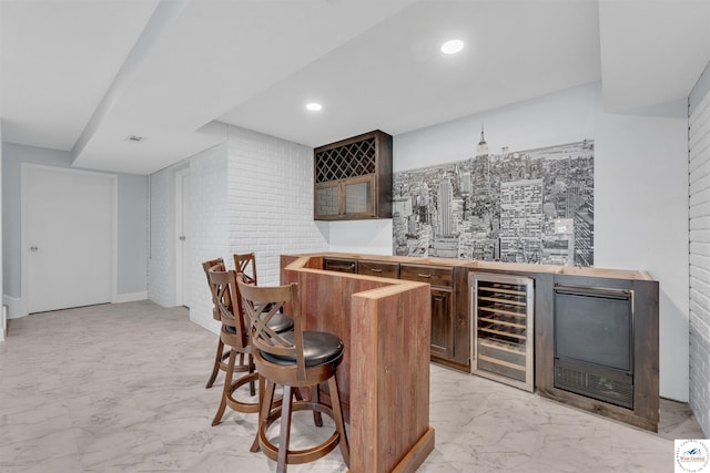 1715 Sycamore Dr, Sedalia, MO 65301 - bar featuring beverage cooler, recessed lighting, indoor wet bar, and marble finish floor
