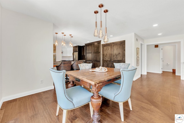 1715 Sycamore Dr, Sedalia, MO 65301 - dining area featuring visible vents, recessed lighting, light wood-style flooring, and baseboards