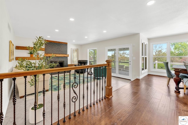 1715 Sycamore Dr, Sedalia, MO 65301 - hall with wood finished floors, plenty of natural light, recessed lighting, and baseboards