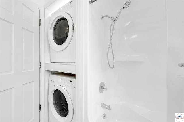 1715 Sycamore Dr, Sedalia, MO 65301 - clothes washing area with stacked washer / drying machine and laundry area