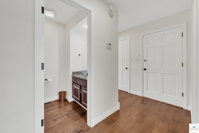 1715 Sycamore Dr, Sedalia, MO 65301 - corridor featuring dark wood finished floors and baseboards