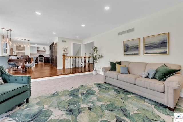 1715 Sycamore Dr, Sedalia, MO 65301 - living room with visible vents, recessed lighting, a notable chandelier, and baseboards