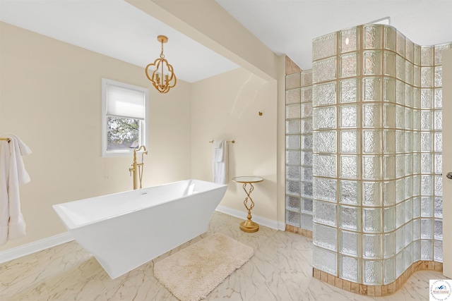 1715 Sycamore Dr, Sedalia, MO 65301 - full bath featuring an inviting chandelier, a walk in shower, marble finish floor, baseboards, and a soaking tub