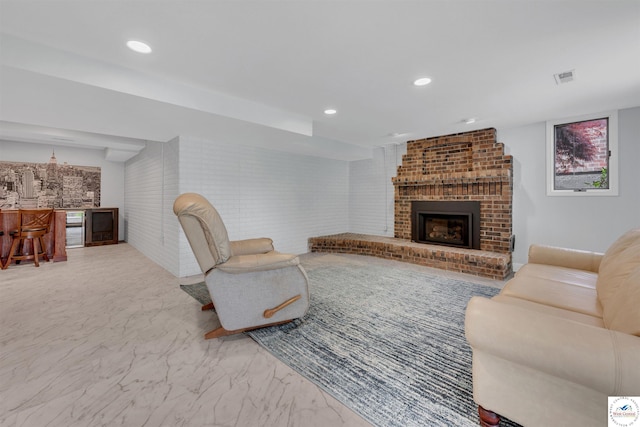 1715 Sycamore Dr, Sedalia, MO 65301 - living room featuring recessed lighting, marble finish floor, a brick fireplace, visible vents, and indoor bar