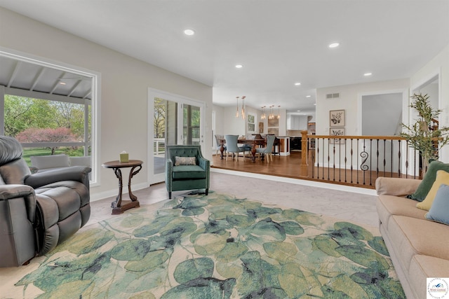 1715 Sycamore Dr, Sedalia, MO 65301 - living room featuring visible vents, recessed lighting, a wealth of natural light, and baseboards