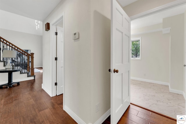 1715 Sycamore Dr, Sedalia, MO 65301 - corridor featuring baseboards, dark wood finished floors, and stairs