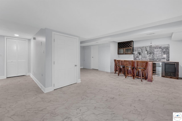 1715 Sycamore Dr, Sedalia, MO 65301 - bar with wet bar, beverage cooler, baseboards, recessed lighting, and marble finish floor