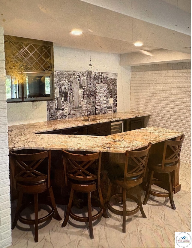 1715 Sycamore Dr, Sedalia, MO 65301 - indoor wet bar featuring light marble finish flooring and recessed lighting
