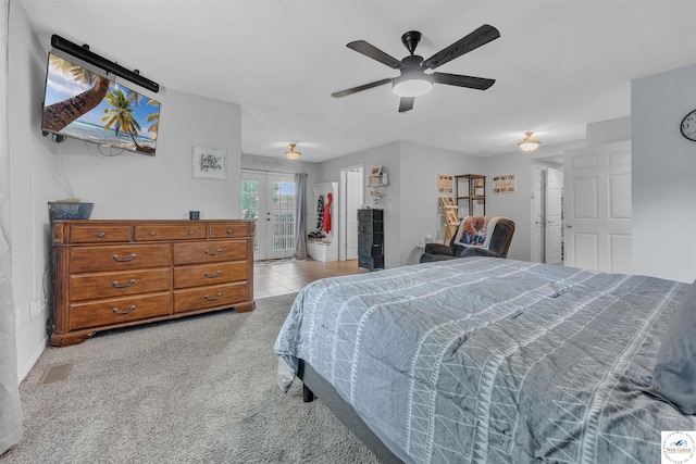 2510 Stephenson Ave, Sedalia, MO 65301 - carpeted bedroom featuring access to exterior, french doors, and a ceiling fan