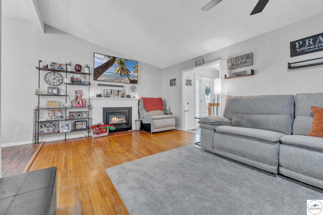 2510 Stephenson Ave, Sedalia, MO 65301 - living area with ceiling fan, wood finished floors, healthy amount of natural light, a textured ceiling, and lofted ceiling