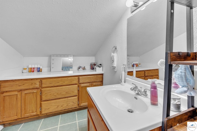 2510 Stephenson Ave, Sedalia, MO 65301 - bathroom with lofted ceiling, a textured ceiling, and vanity