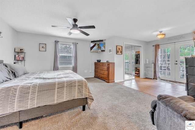 2510 Stephenson Ave, Sedalia, MO 65301 - bedroom featuring access to outside, french doors, ceiling fan, tile patterned floors, and carpet floors