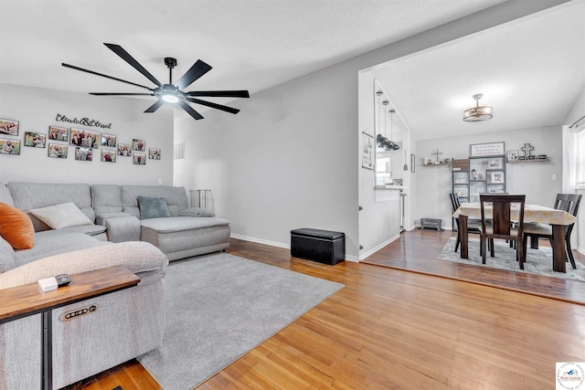2510 Stephenson Ave, Sedalia, MO 65301 - living area featuring light wood-style flooring, a ceiling fan, and baseboards