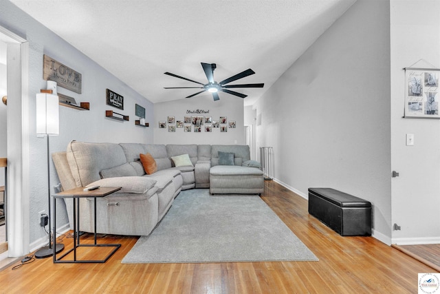 2510 Stephenson Ave, Sedalia, MO 65301 - living room featuring a ceiling fan, wood finished floors, vaulted ceiling, and baseboards