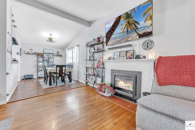 2510 Stephenson Ave, Sedalia, MO 65301 - living area with wood-type flooring, a brick fireplace, and baseboards
