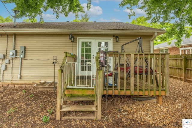 2510 Stephenson Ave, Sedalia, MO 65301 - back of property featuring fence, french doors, a deck, and roof with shingles