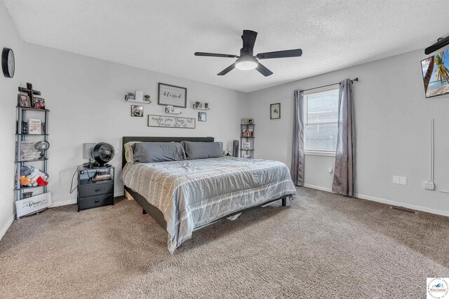 2510 Stephenson Ave, Sedalia, MO 65301 - carpeted bedroom featuring baseboards, a textured ceiling, and a ceiling fan