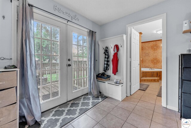 2510 Stephenson Ave, Sedalia, MO 65301 - mudroom with french doors and light tile patterned flooring