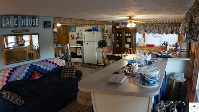 31560 Branch Ave, Warsaw, MO 65355 - kitchen featuring a ceiling fan and white appliances
