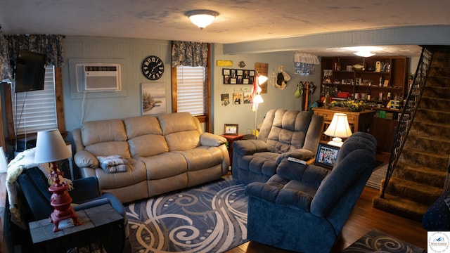 31560 Branch Ave, Warsaw, MO 65355 - living area with wood finished floors, stairs, and a wall mounted air conditioner