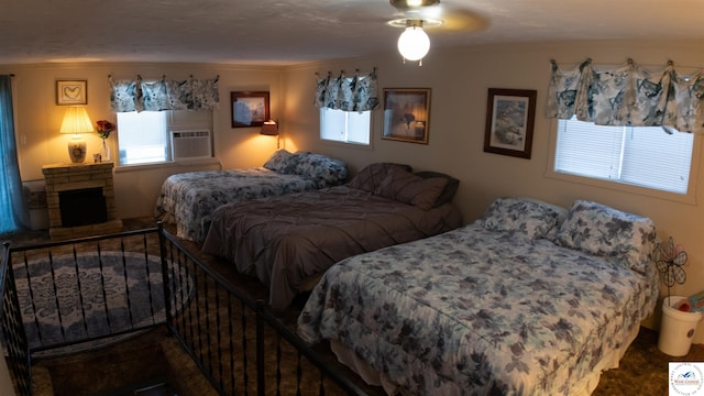 31560 Branch Ave, Warsaw, MO 65355 - bedroom with crown molding, cooling unit, and a fireplace