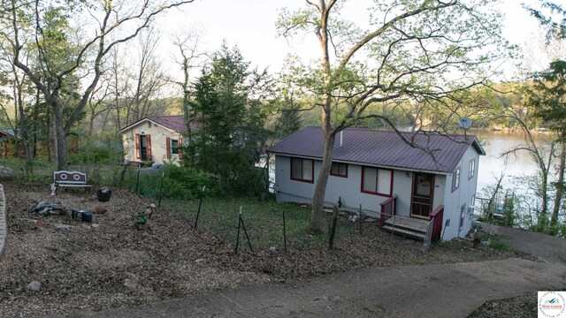 31560 Branch Ave, Warsaw, MO 65355 - view of front facade with metal roof