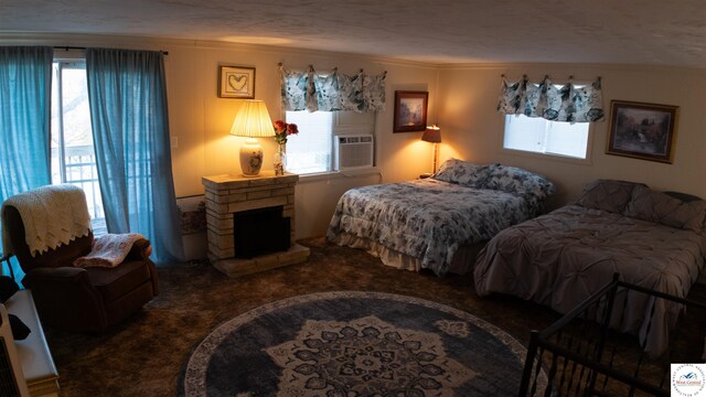 31560 Branch Ave, Warsaw, MO 65355 - carpeted bedroom with crown molding, cooling unit, and a fireplace with raised hearth