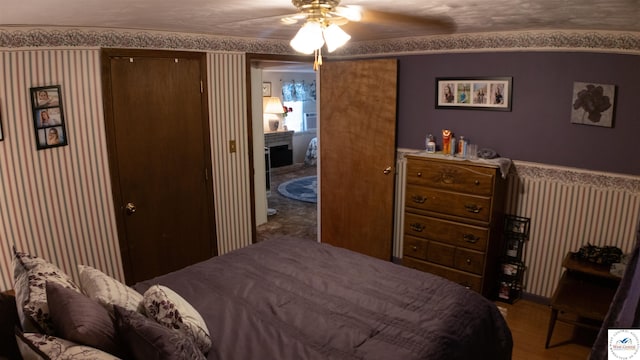 31560 Branch Ave, Warsaw, MO 65355 - bedroom with ceiling fan, wood finished floors, and wallpapered walls