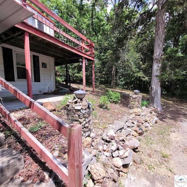 view of yard featuring a wooden deck