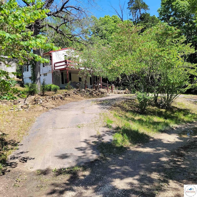 view of front of house featuring asphalt driveway
