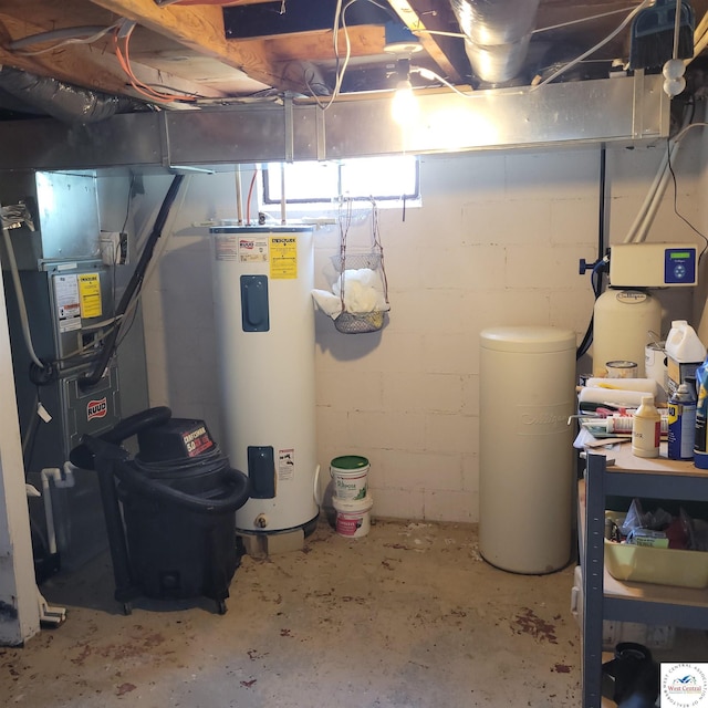 utility room featuring electric water heater and heating unit