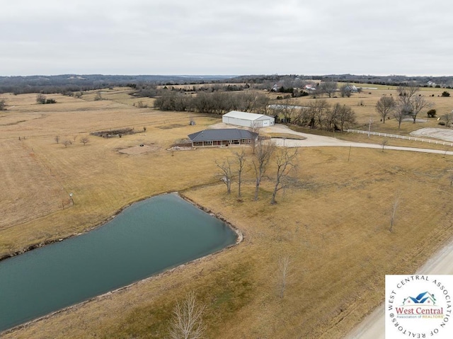 bird's eye view featuring a rural view and a water view