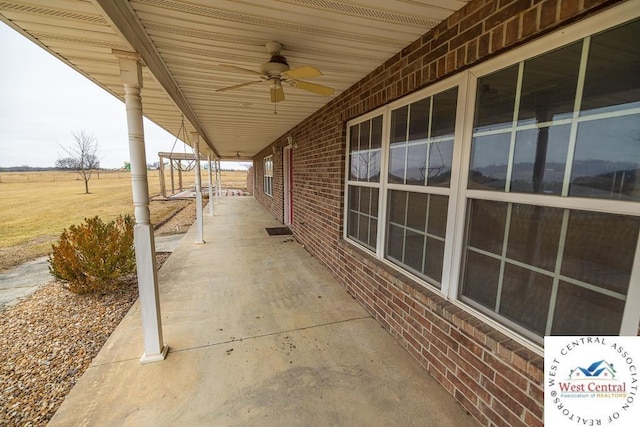 view of patio featuring ceiling fan