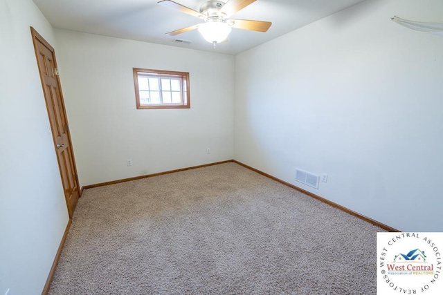 spare room featuring visible vents, ceiling fan, carpet, and baseboards