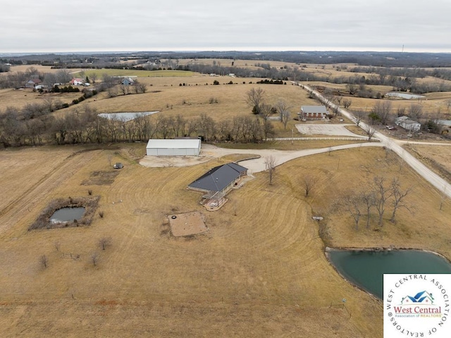 bird's eye view featuring a rural view and a water view