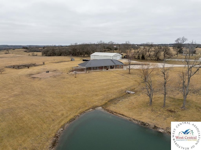 aerial view featuring a rural view and a water view