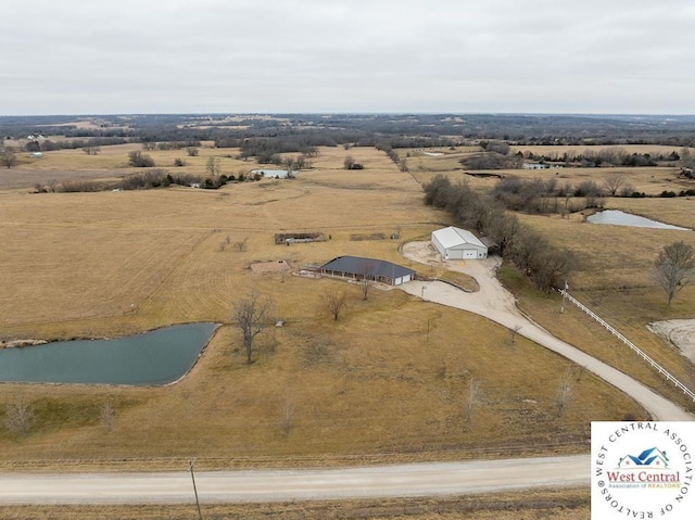 bird's eye view featuring a rural view and a water view